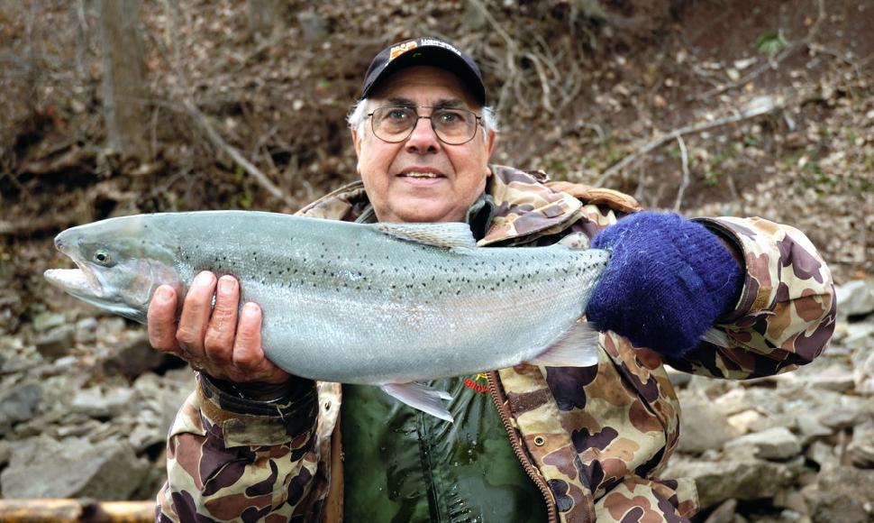 Tony Valeriote with a gorgeous rainbow trout he caught in the Niagara River using one of his hand-made Slinky sinkers.