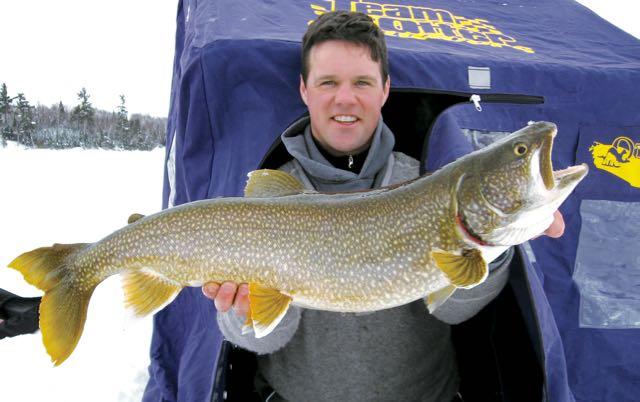 The author and Ryan Haines (above) refined a tube jig pattern to catch lunker lake trout. Credit: Gord Pyzer.