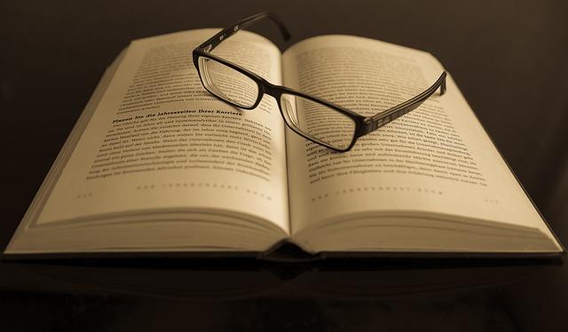 Eyeglasses on book