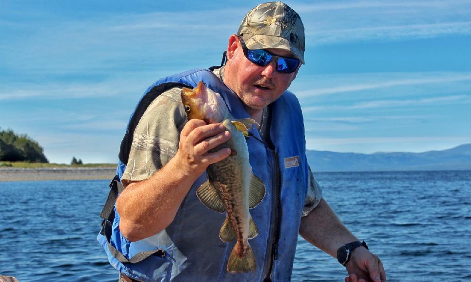 Park and a freshly caught cod. Credit: Darcy Rhyno.