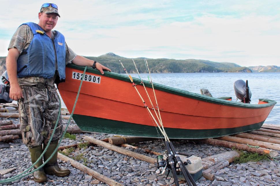 Four Season Tours owner Darren Park with a traditional dory. Credit: Darcy Rhyno.