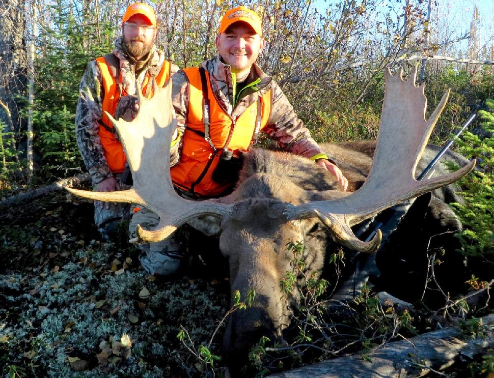 The author (left) and hunting TV host Taylor Wright with Wright’s moose, taken on camera. Credit: Adrian Skok.