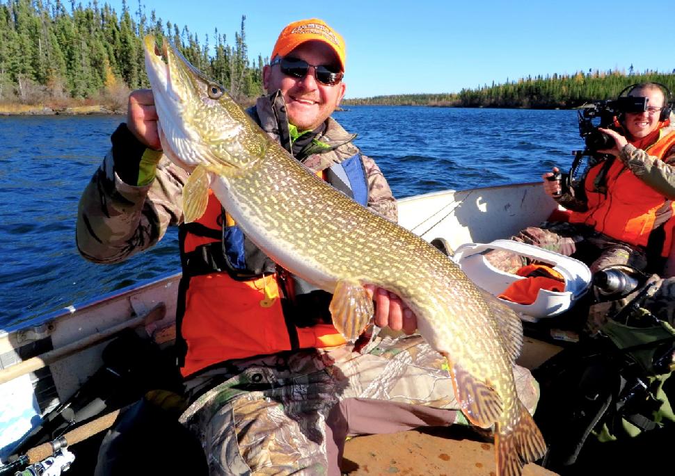 Taylor Wright hoists a beefy pike. Credit: Adrian Skok.