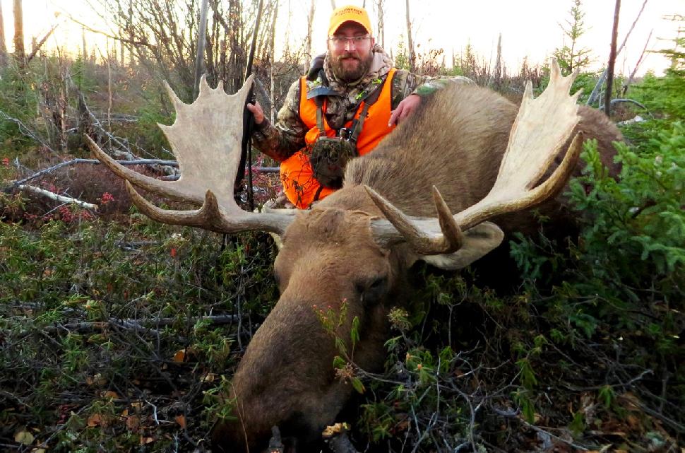 The author and his hard-earned bull, taken in the last moments of the hunt. Credit: Adrian Skok.