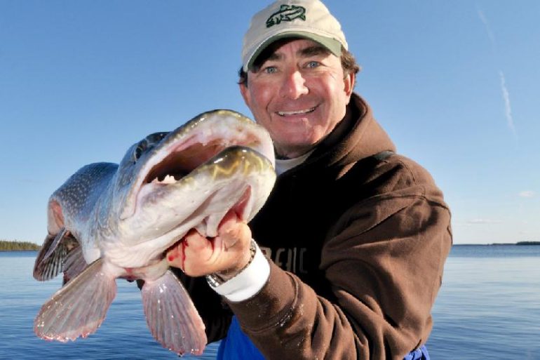 Credit: Gord Pyzer. The author and a trophy fall pike.