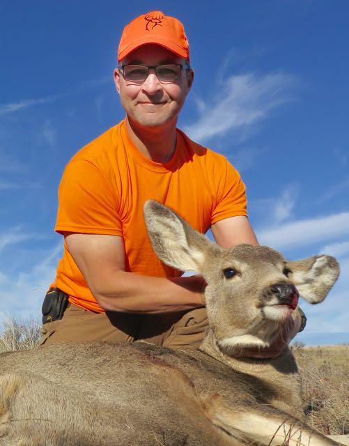 The author with a cleanly killed doe for the freezer. Credit: Lowell Strauss.