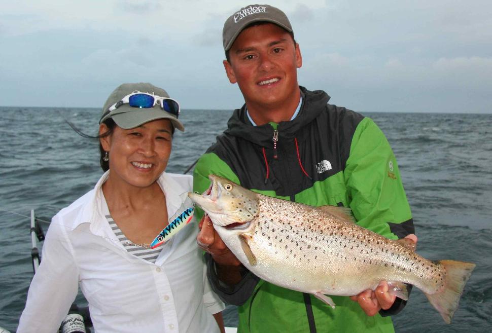 Mission accomplished: Sandra and Captain Nick Lee with her first-ever brown trout