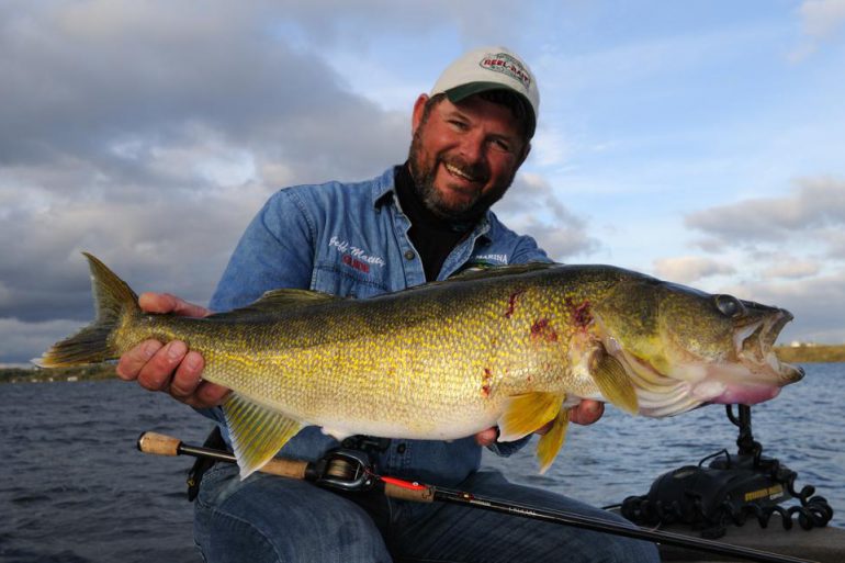 Jeff with the 13-pound walleye we caught last year fishing with Fergie Spoons. By the way, the scars on the fish are caused by pelicans that harass the walleyes while they spawn in the spring.
