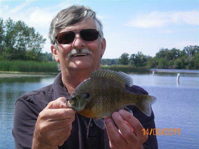 My good buddy Allen with a bull Manitoba bluegill