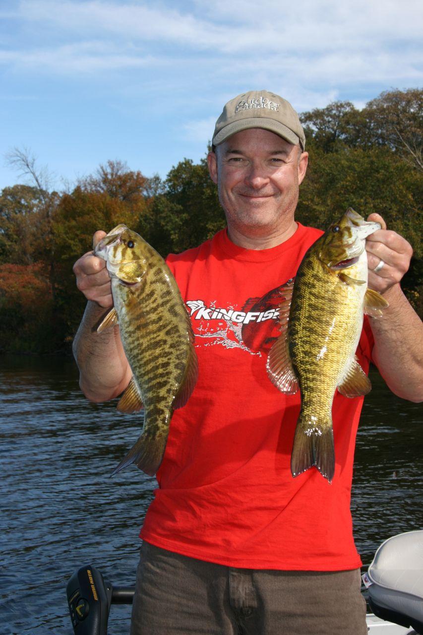 Fall smallies: Outdoor Canada editor Patrick Walsh and a couple of colourful Rice Lake tigers