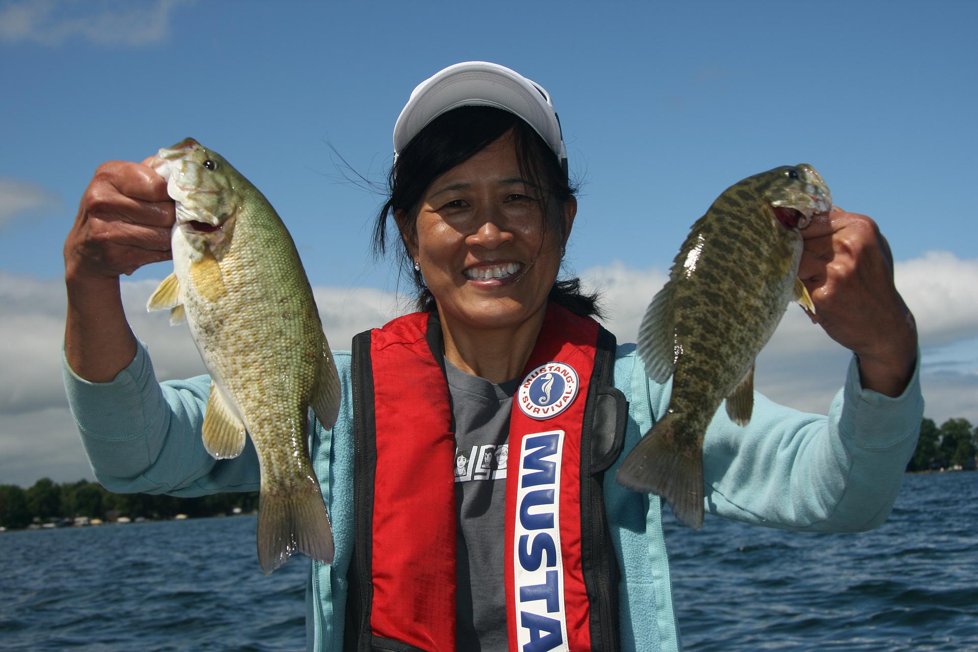 Art director Sandra Cheung with a pair of Lake Simcoe smallies