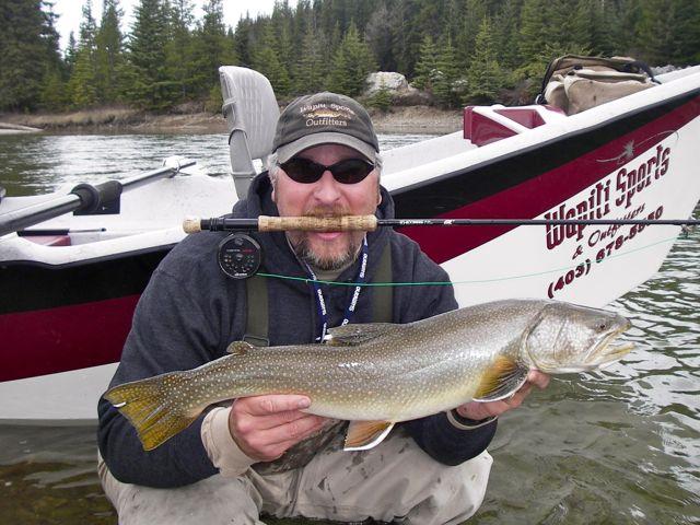 Store owner Nick Schlachter with another fine bull trout.