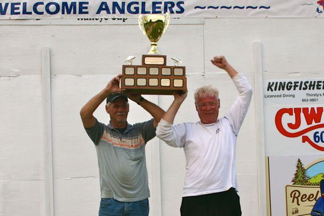 Bill Jung (left) and Doug Zwingli hoist the coveted Premiers’s Walleye Cup. Credit: Michael Oleksyn.