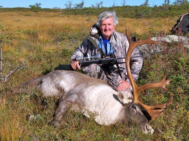 Hunter with his woodland caribou kill