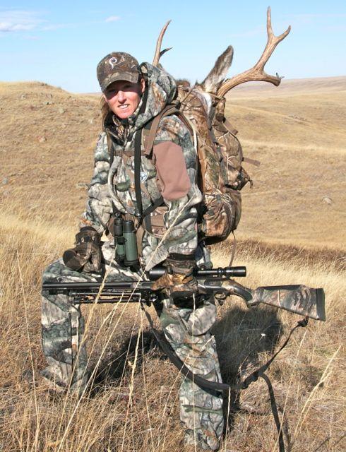 Heather Wilson packs out her mulie trophy, on foot. Credit: Kevin Wilson.