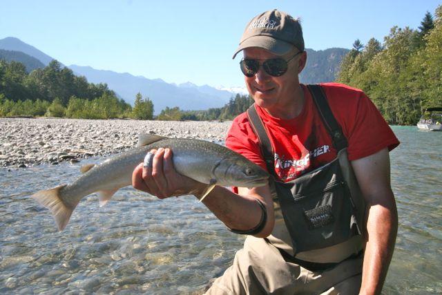 Credit: Tony Nootebos. The author and a sea-run bull trout.