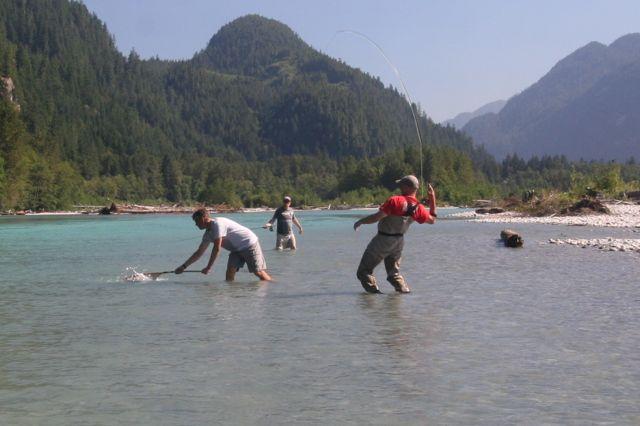 Credit: Yves Bisson. Tony Nootebos nets a fish for the author.