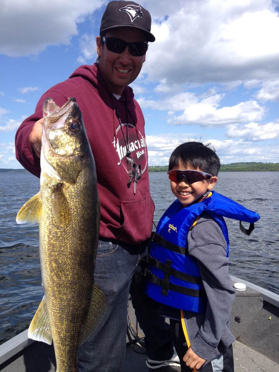 Walleye caught by a man and his son