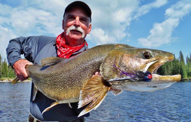 Credit: Patrick Walsh. John Cleveland and one of his fly-caught lakers.