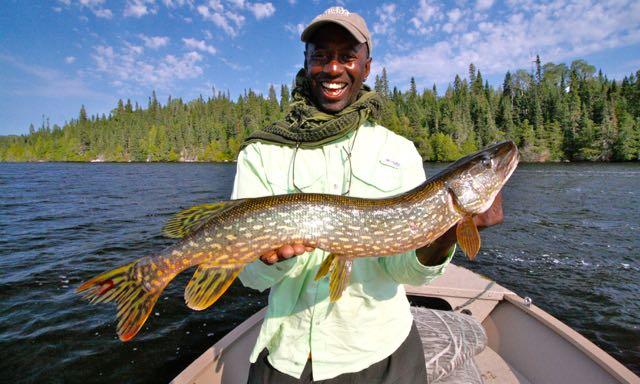 Wes hoists his biggest ever northern pike. Credit: Scott Gardner.