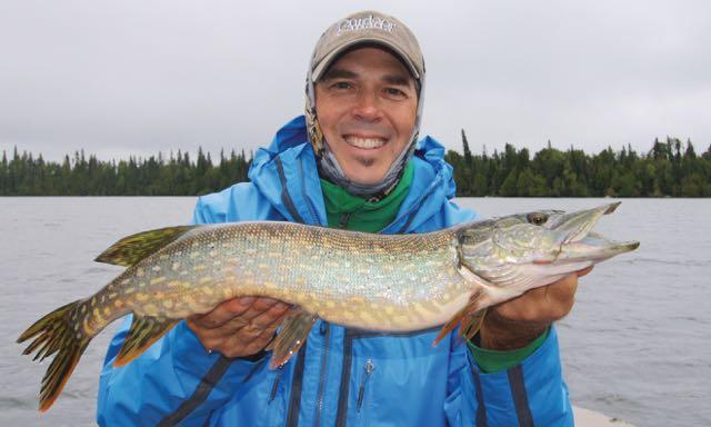 The author with a rainy-day pike. Credit: Sam Gardner.