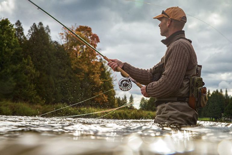 Fisherman wading