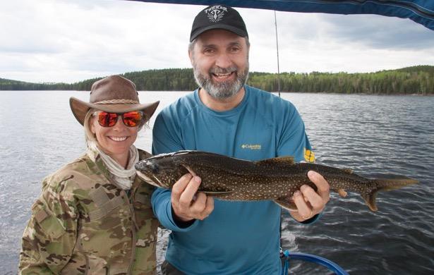 Kyla and Lawrence show off a lake trout from Ritchie Falls Resort.