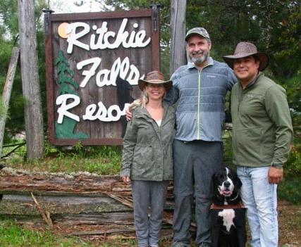 (Left to right) Kyla Owl, Lawrence Gunther, Moby the service dog, Matthew Owl