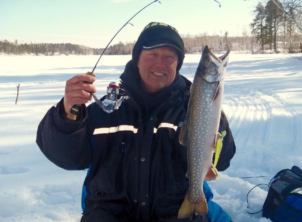 Wil Wegman works two ice rods for lake trout. Credit: Wil Wegman.