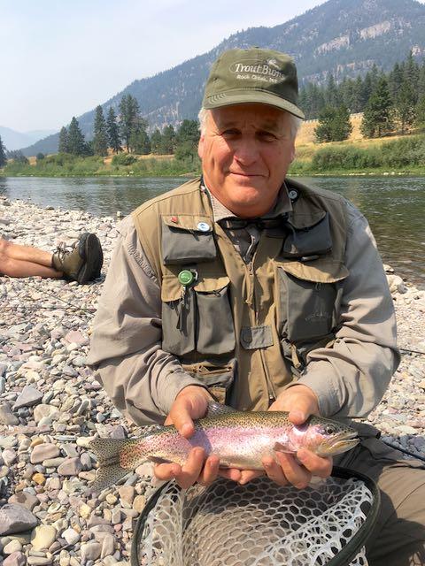 The author holds a rainbow trout he caught on the Clark Fork in Montana. Credit: James Quigley.